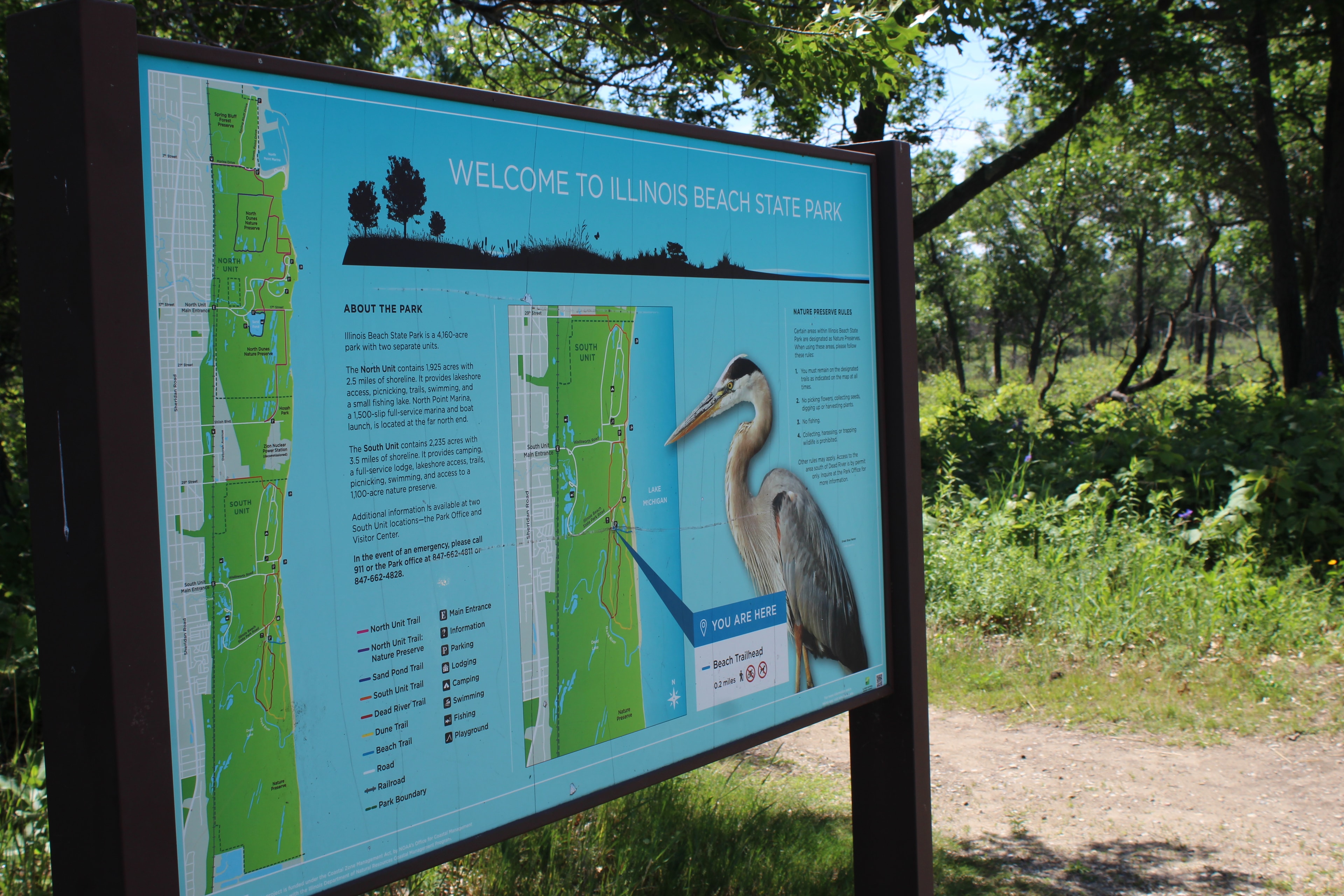 Welcome to Illinois Beach State Park sign with trail map and great blue heron
